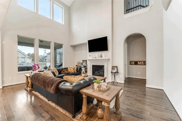 a living room with fireplace furniture and a flat screen tv