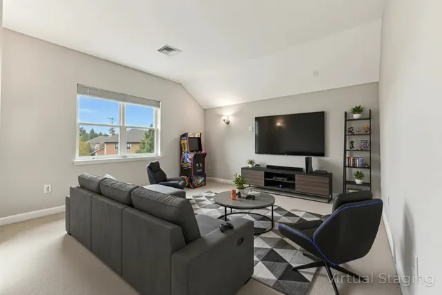 a spacious bedroom with a bed and furniture