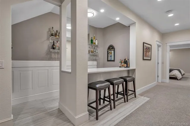 a view of kitchen with furniture and wooden floor