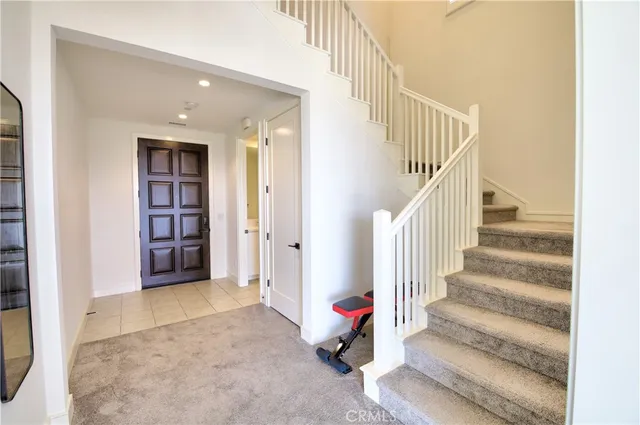 a view of entryway and hall with a rug