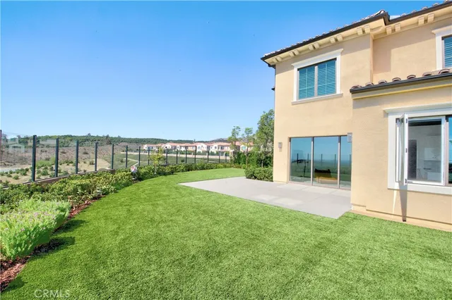 a view of house with backyard and outdoor space