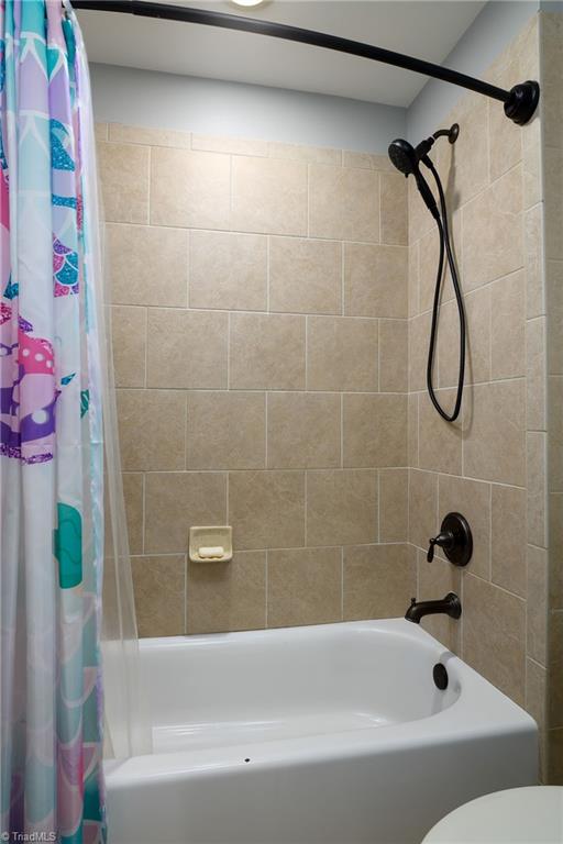 8931 Grove Park Drive Oak Ridge, NC 27310 - Photo 26 of 36 pocket door to shower