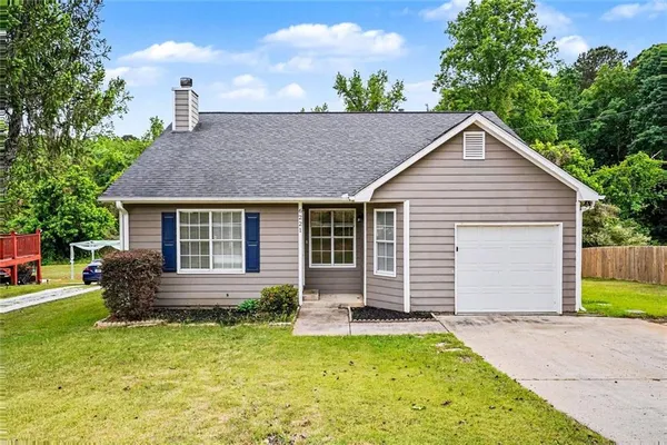 a front view of house with yard and seating area