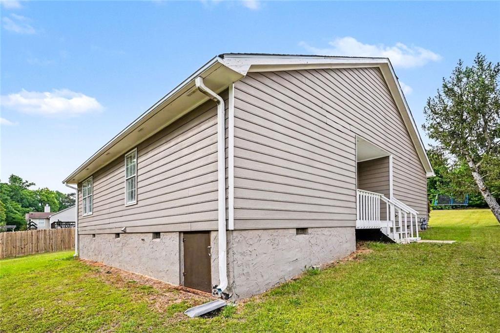 6221 Amberly Road Rex, GA 30273 - Photo 17 of 17 a view of house with backyard