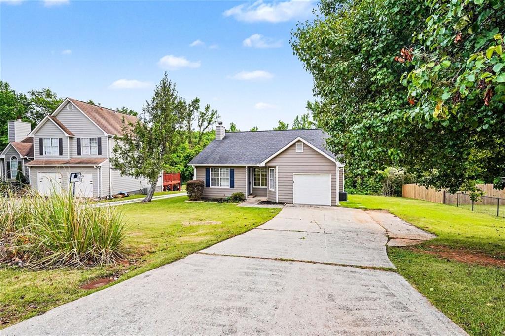 6221 Amberly Road Rex, GA 30273 - Photo 2 of 17 a view of a yard in front of a house with large trees