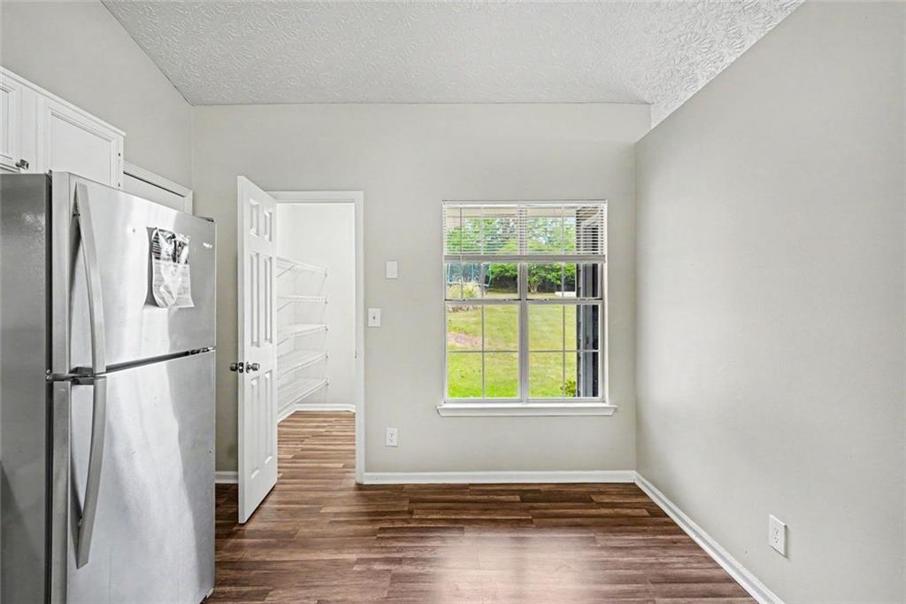 6221 Amberly Road Rex, GA 30273 - Photo 6 of 17 a view of a kitchen with wooden floor electronic appliances and window
