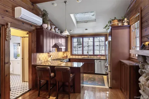 a kitchen with granite countertop lots of counter space and breakfast area