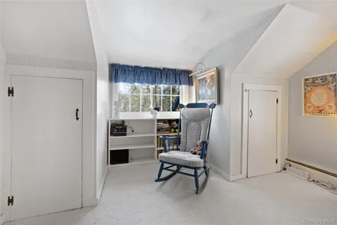 a view of kitchen with furniture and windows