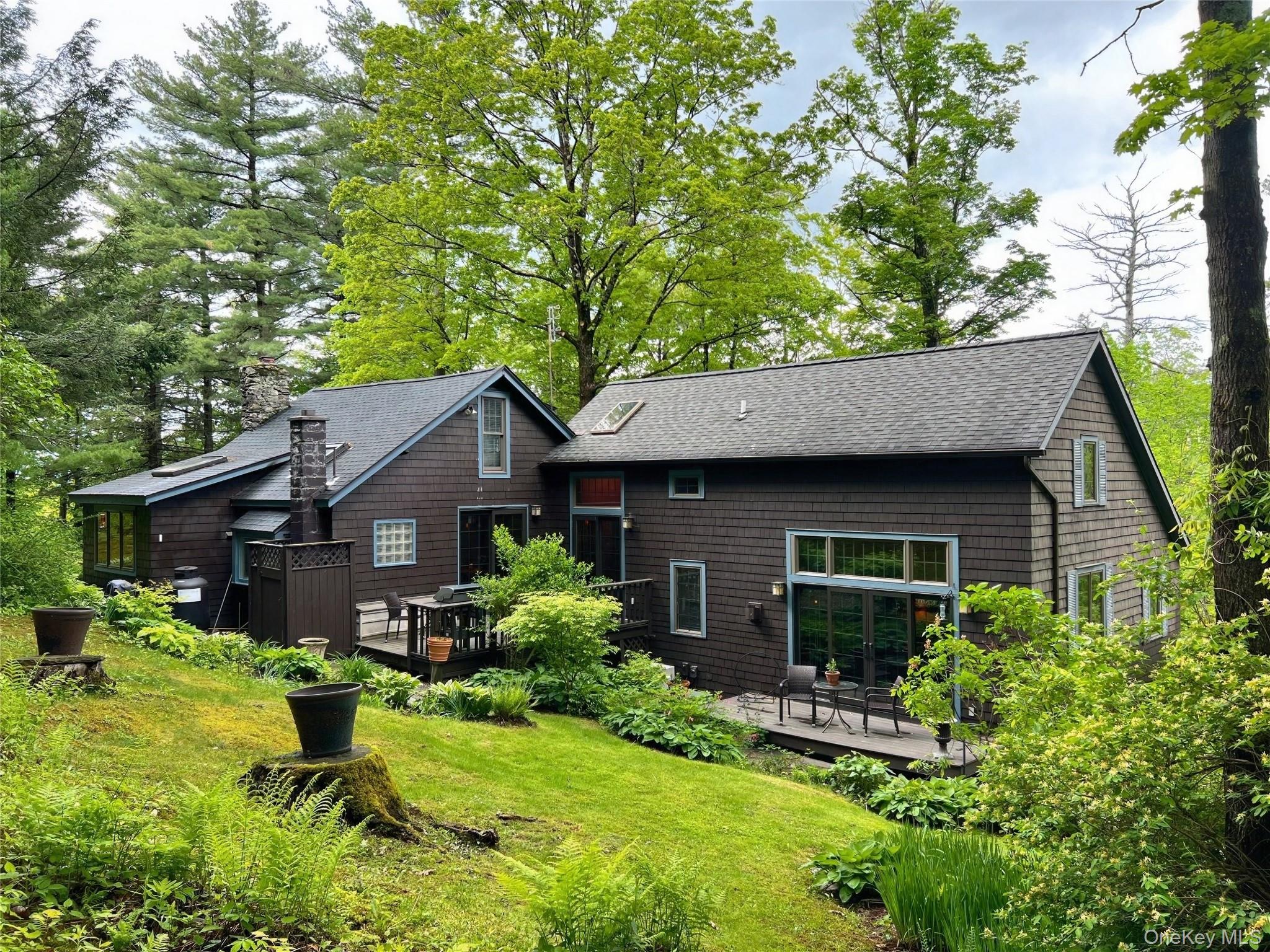 326 Pratt Hill Road Austerlitz, NY 12037 - Photo 2 of 31 a house view with a garden space