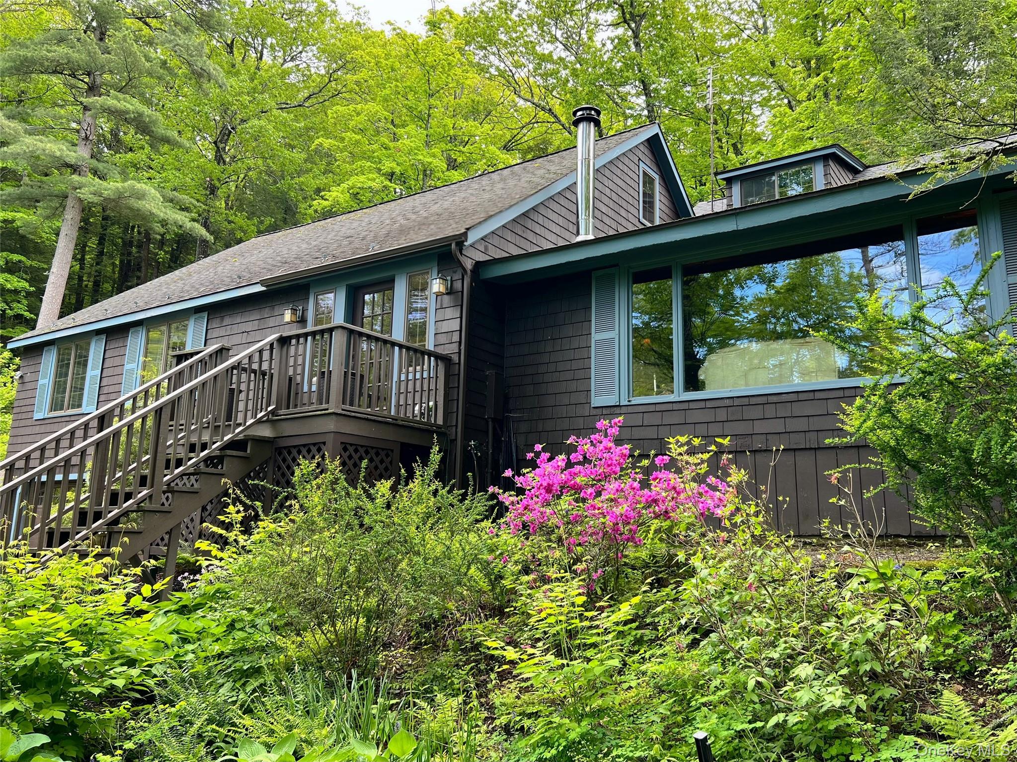 326 Pratt Hill Road Austerlitz, NY 12037 - Photo 22 of 31 a front view of a house with garden