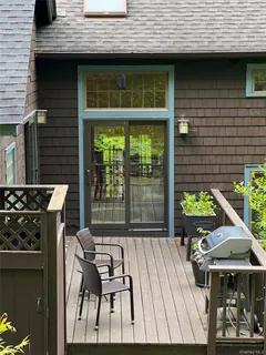 a backyard of a house with seating space