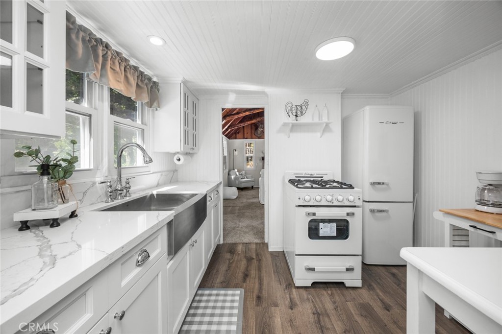 1177 Bear Springs Road Rimforest, CA 92378 - Photo 13 of 37 a kitchen with a sink stove and refrigerator