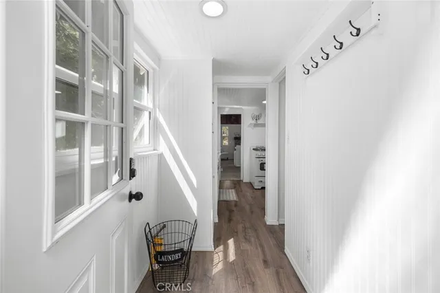 a view of entryway with wooden floor and stairs