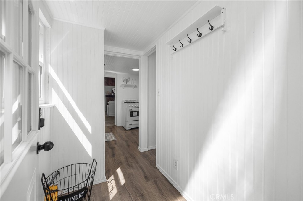 1177 Bear Springs Road Rimforest, CA 92378 - Photo 17 of 37 a view of a hallway with wooden floor and staircase