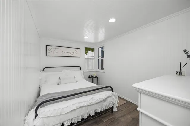 a bedroom with a bed and a table