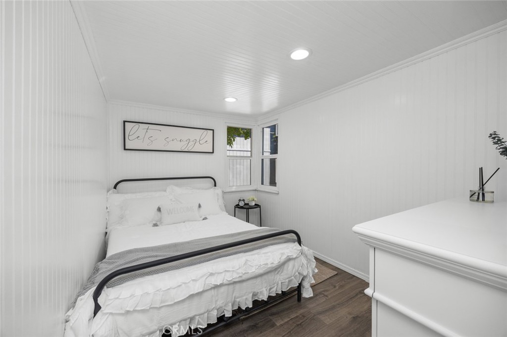 1177 Bear Springs Road Rimforest, CA 92378 - Photo 18 of 37 a bedroom with a bed and a table