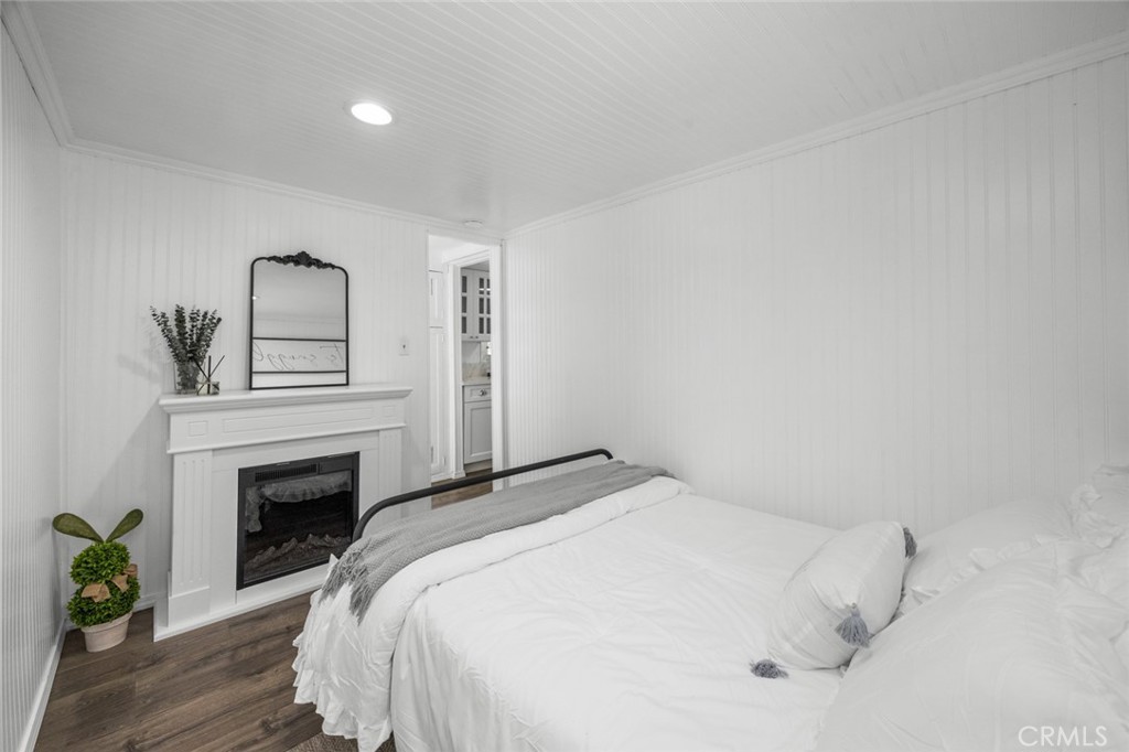1177 Bear Springs Road Rimforest, CA 92378 - Photo 19 of 37 a bedroom with a bed and a fireplace