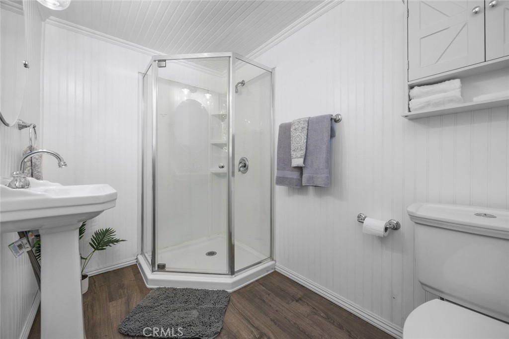 1177 Bear Springs Road Rimforest, CA 92378 - Photo 21 of 37 a bathroom with a shower a toilet and sink
