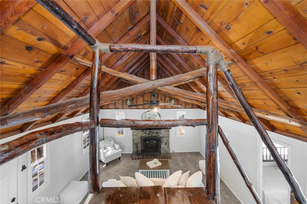 1177 Bear Springs Road Rimforest, CA 92378 - Photo 29 of 37 a roof deck with table and chairs with wooden floor