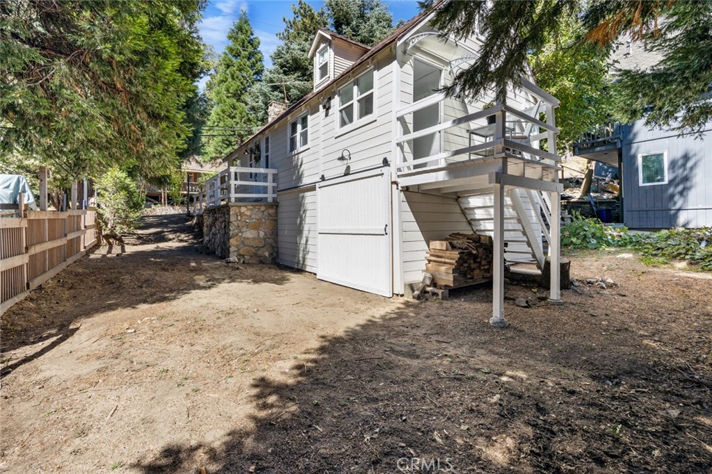 1177 Bear Springs Road Rimforest, CA 92378 - Photo 31 of 37 a view of a house with a yard