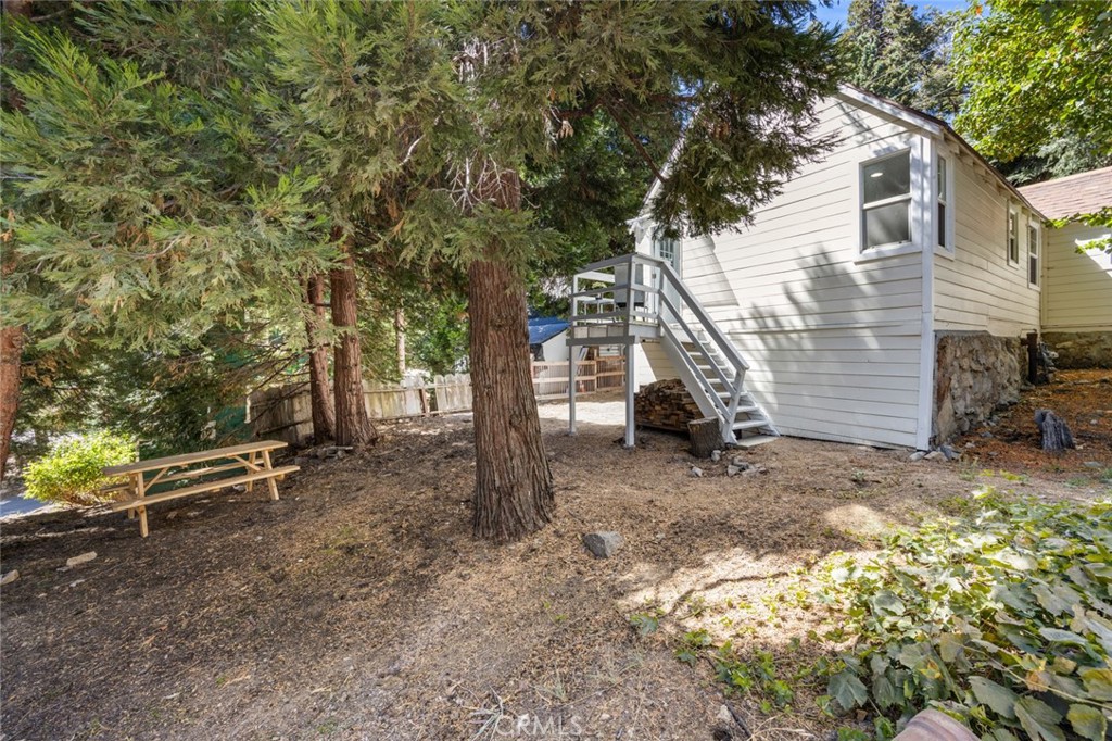 1177 Bear Springs Road Rimforest, CA 92378 - Photo 32 of 37 a view of a house with a yard