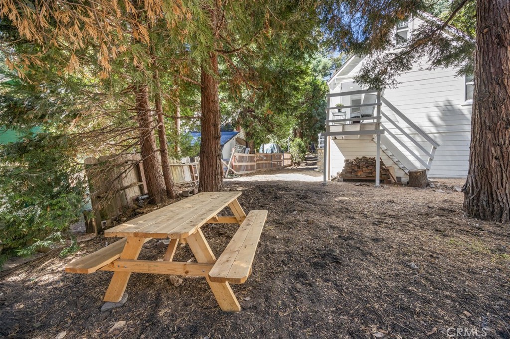 1177 Bear Springs Road Rimforest, CA 92378 - Photo 33 of 37 a view of backyard with a table and chair