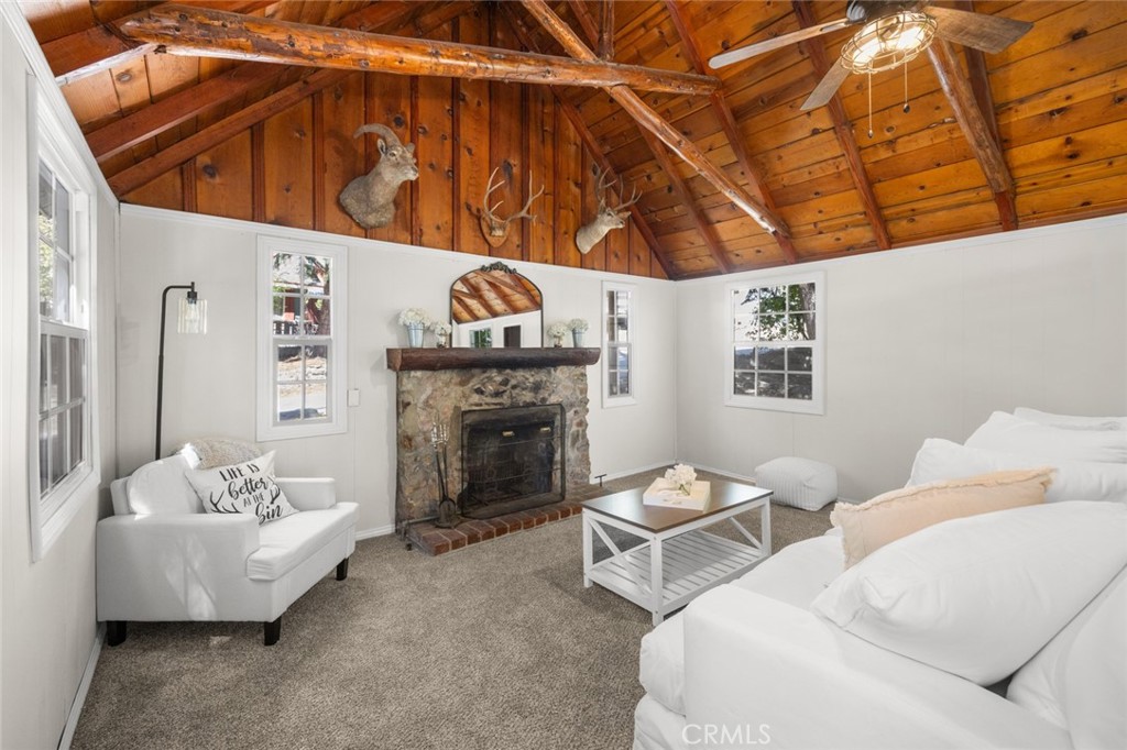1177 Bear Springs Road Rimforest, CA 92378 - Photo 5 of 37 a living room with furniture and a fireplace