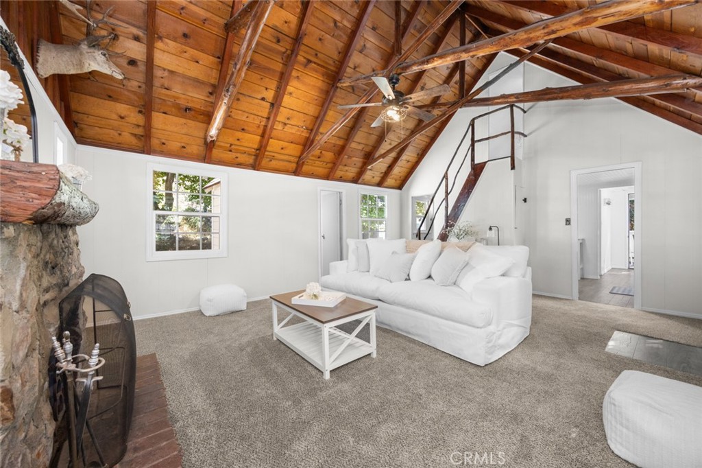 1177 Bear Springs Road Rimforest, CA 92378 - Photo 8 of 37 a living room with furniture and a window