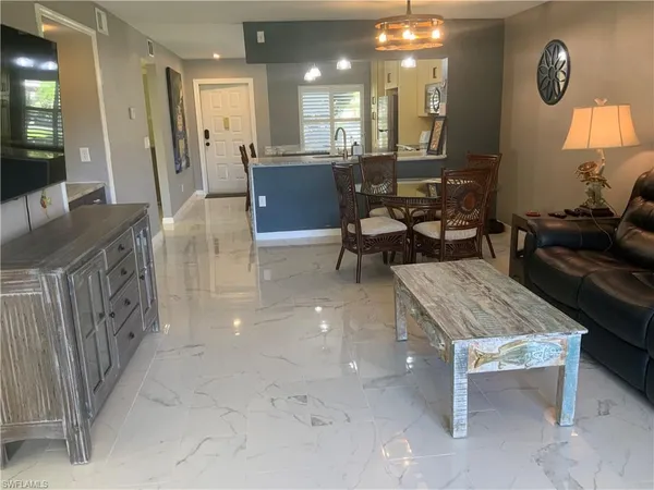 a lobby with furniture and a potted plant