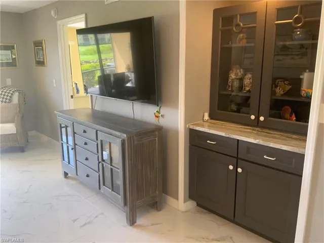 a room with a sink and a mirror