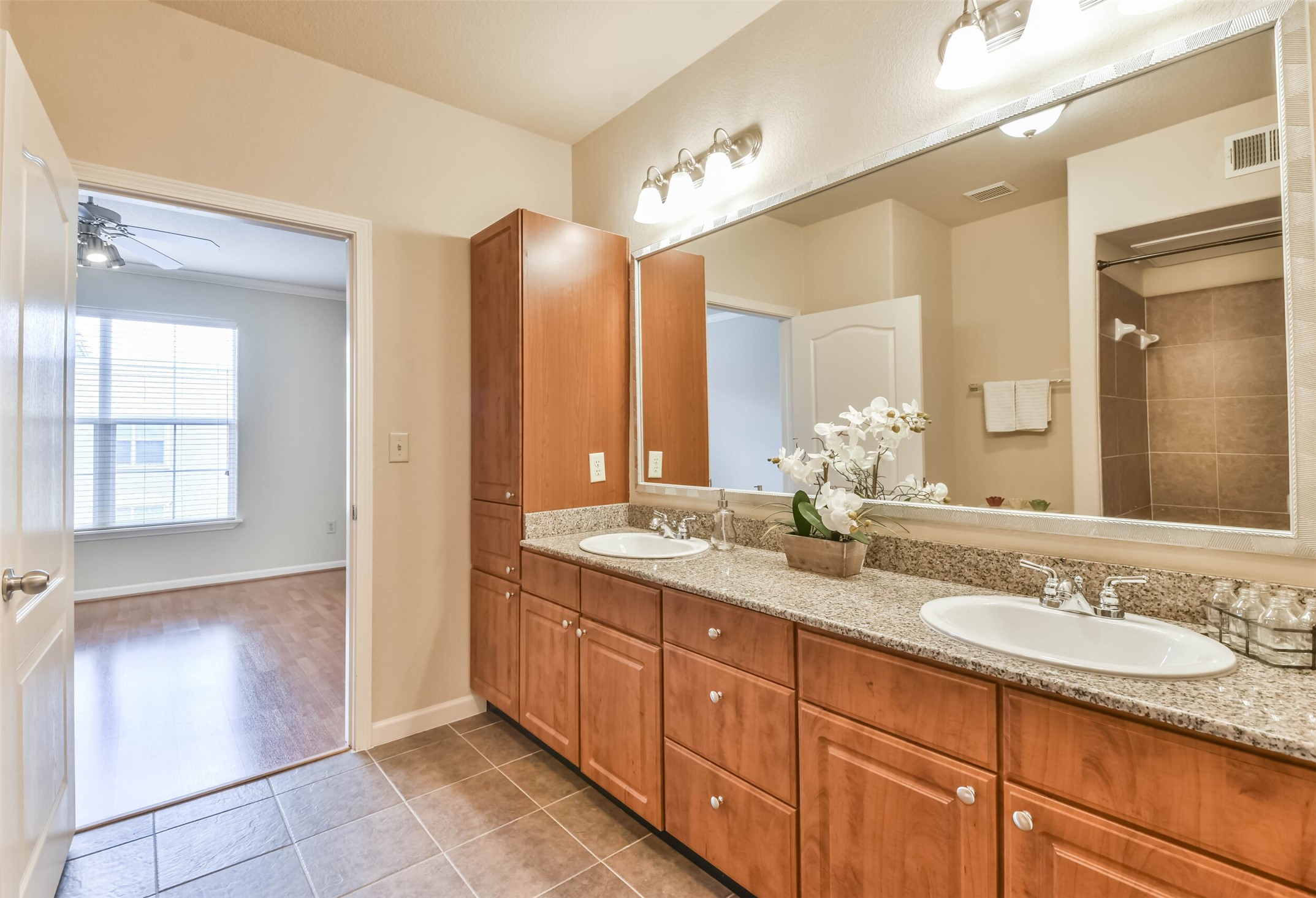 1711 Old Spanish Trail, Unit 406 Houston, TX 77054 - Photo 17 of 30 a bathroom with a granite countertop sink mirror and double