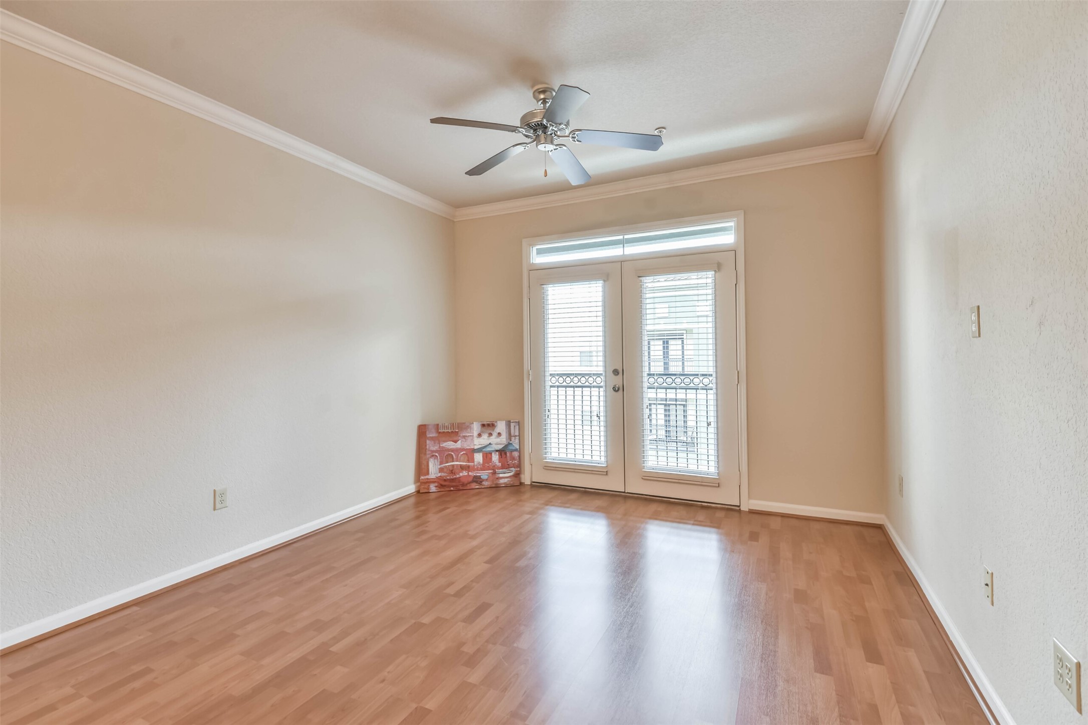 1711 Old Spanish Trail, Unit 406 Houston, TX 77054 - Photo 2 of 30 wooden floor in an empty room with a window