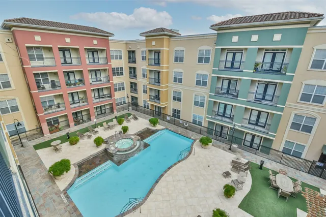 a view of a dining room with furniture and a book shelf