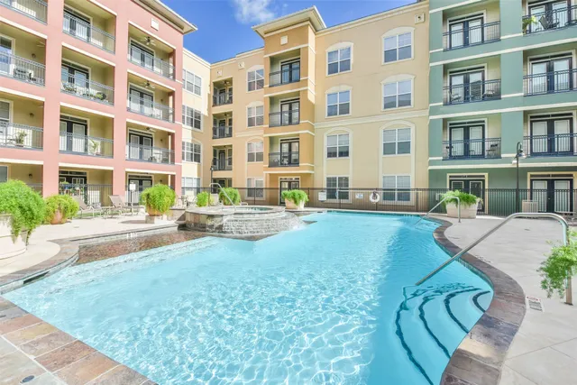 a view of a building with a yard