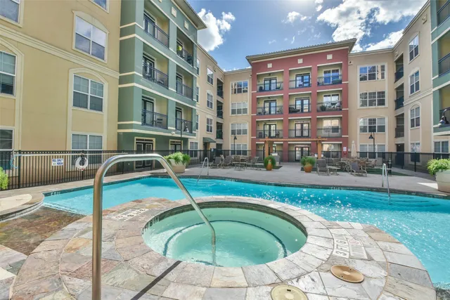 a swimming pool with outdoor seating yard and barbeque oven