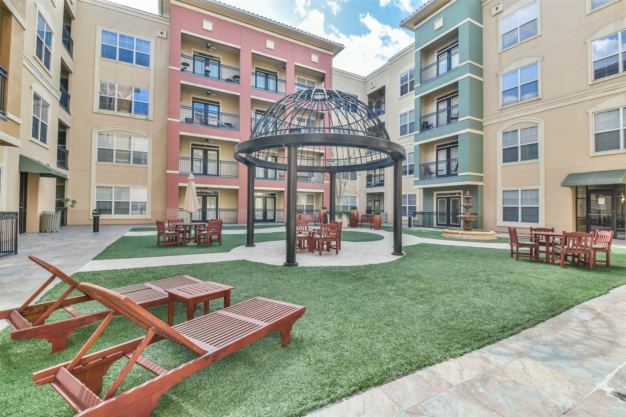 1711 Old Spanish Trail, Unit 406 Houston, TX 77054 - Photo 27 of 30 a front view of a building with a yard