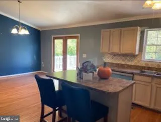 a kitchen with a sink cabinets and window