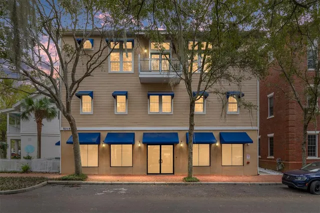 a view of a livingroom with furniture and a window