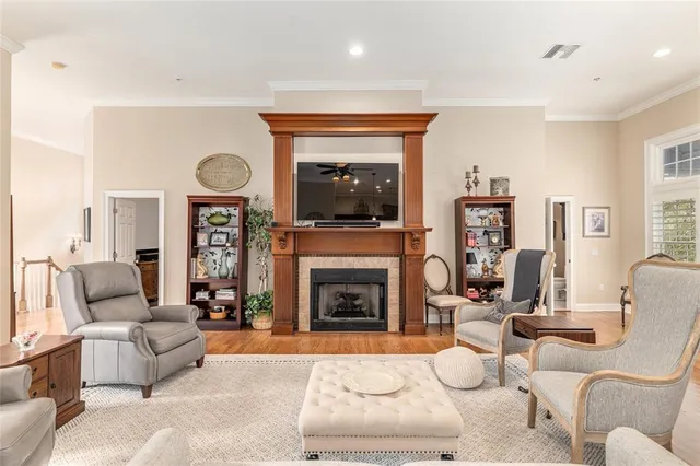 a kitchen with stainless steel appliances granite countertop a refrigerator a stove and a sink with cabinets