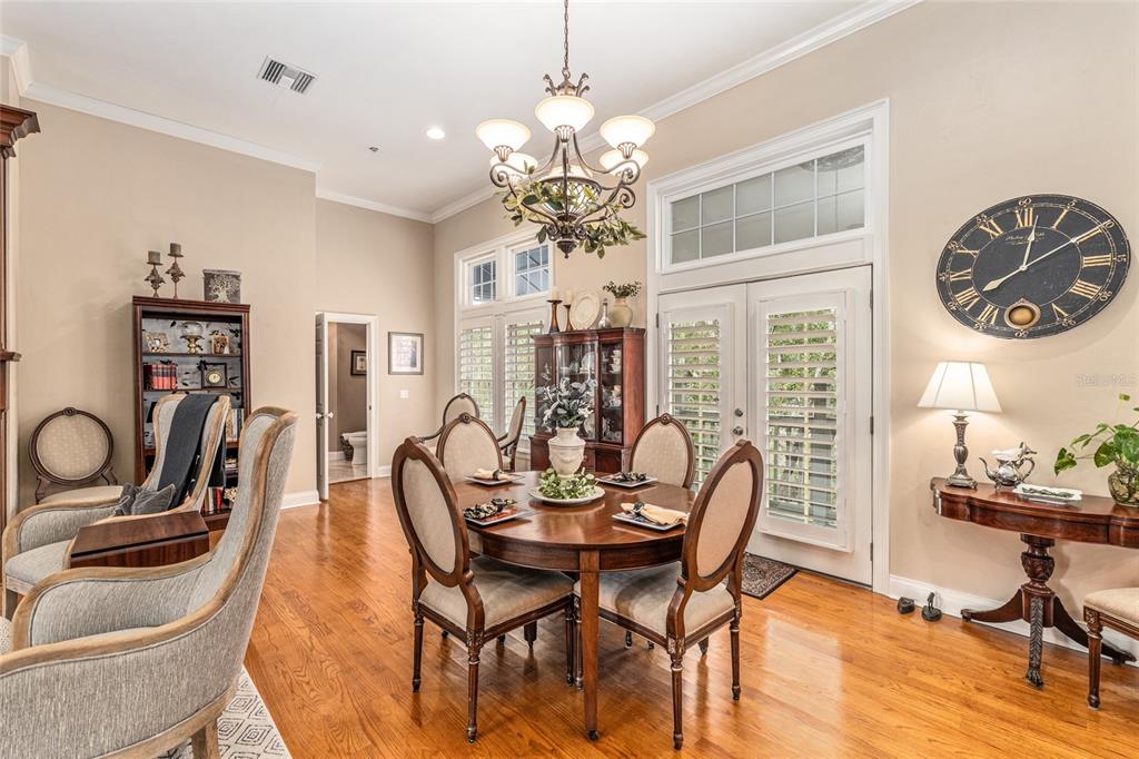 5015 Southwest 91 Terrace Gainesville, FL 32608 - Photo 13 of 61 a view of a dining room with furniture and a chandelier