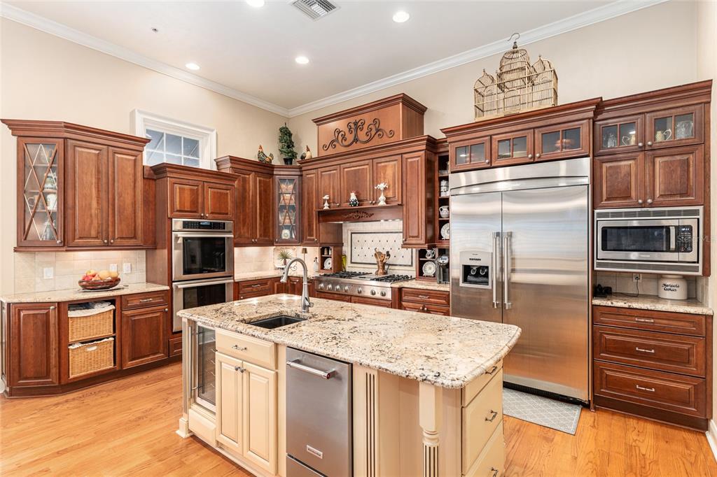 5015 Southwest 91 Terrace Gainesville, FL 32608 - Photo 22 of 61 a kitchen with stainless steel appliances granite countertop a refrigerator stove and oven