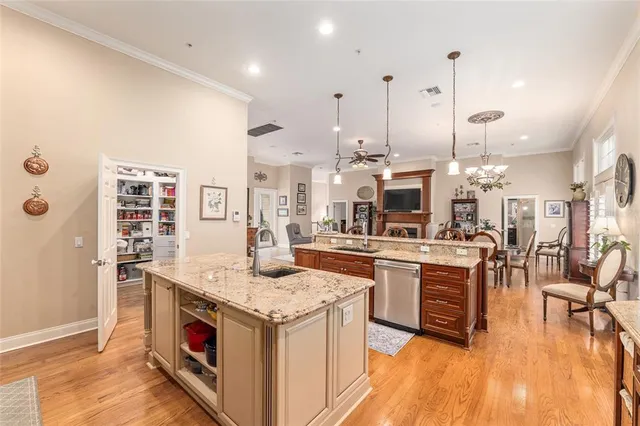 a bedroom with bed and a chandelier
