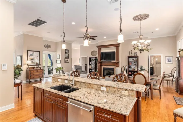 a bedroom with two beds and a chandelier