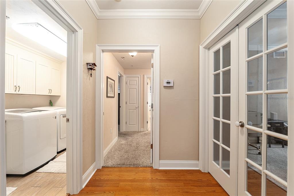 5015 Southwest 91 Terrace Gainesville, FL 32608 - Photo 43 of 61 a view of a hallway with a cabinet and a window