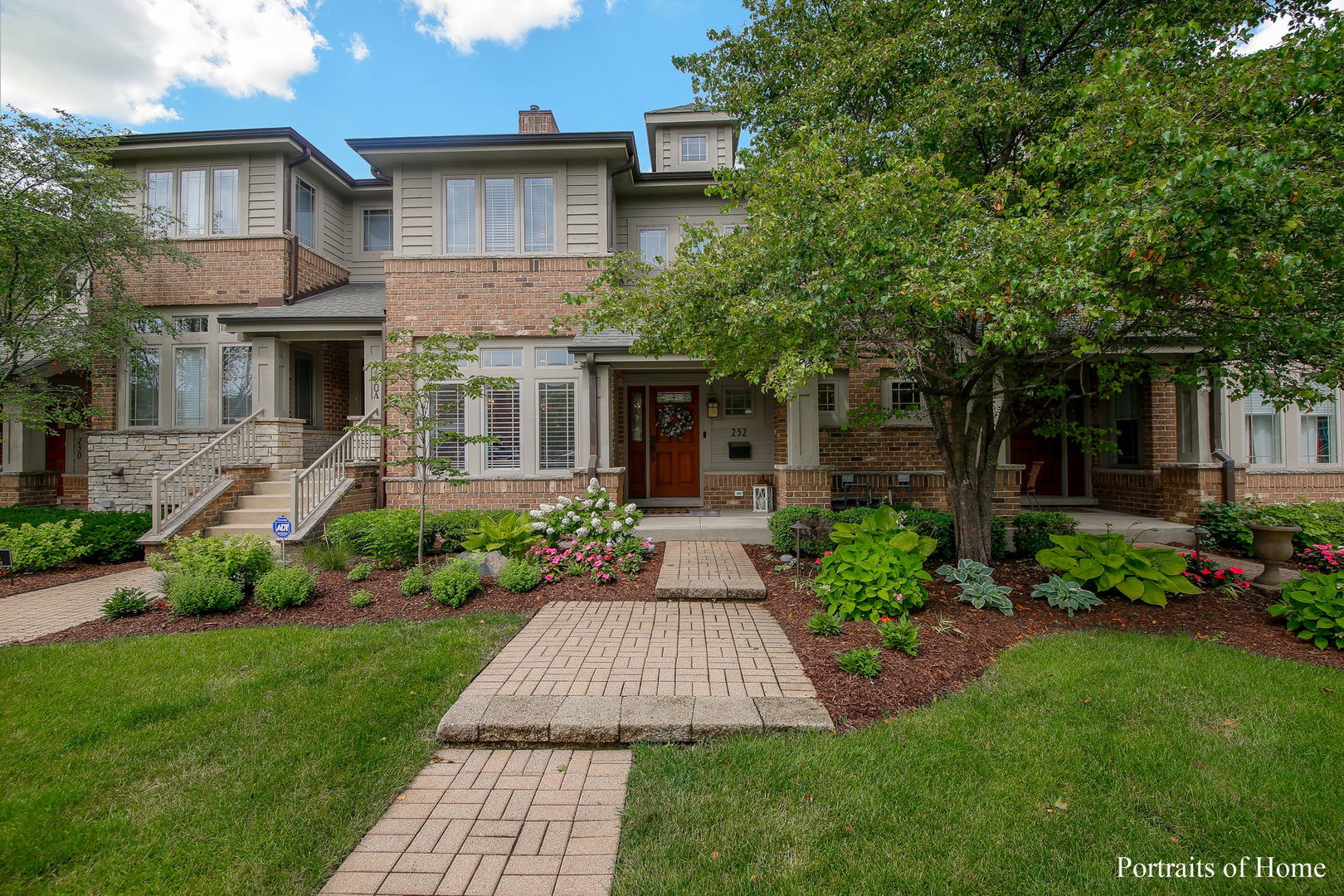 a front view of a house with garden