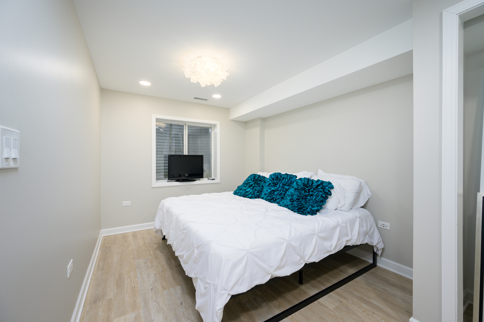 232 North Addison Avenue Elmhurst, IL 60126 - Photo 18 of 28 a bedroom with a bed and a flat screen tv