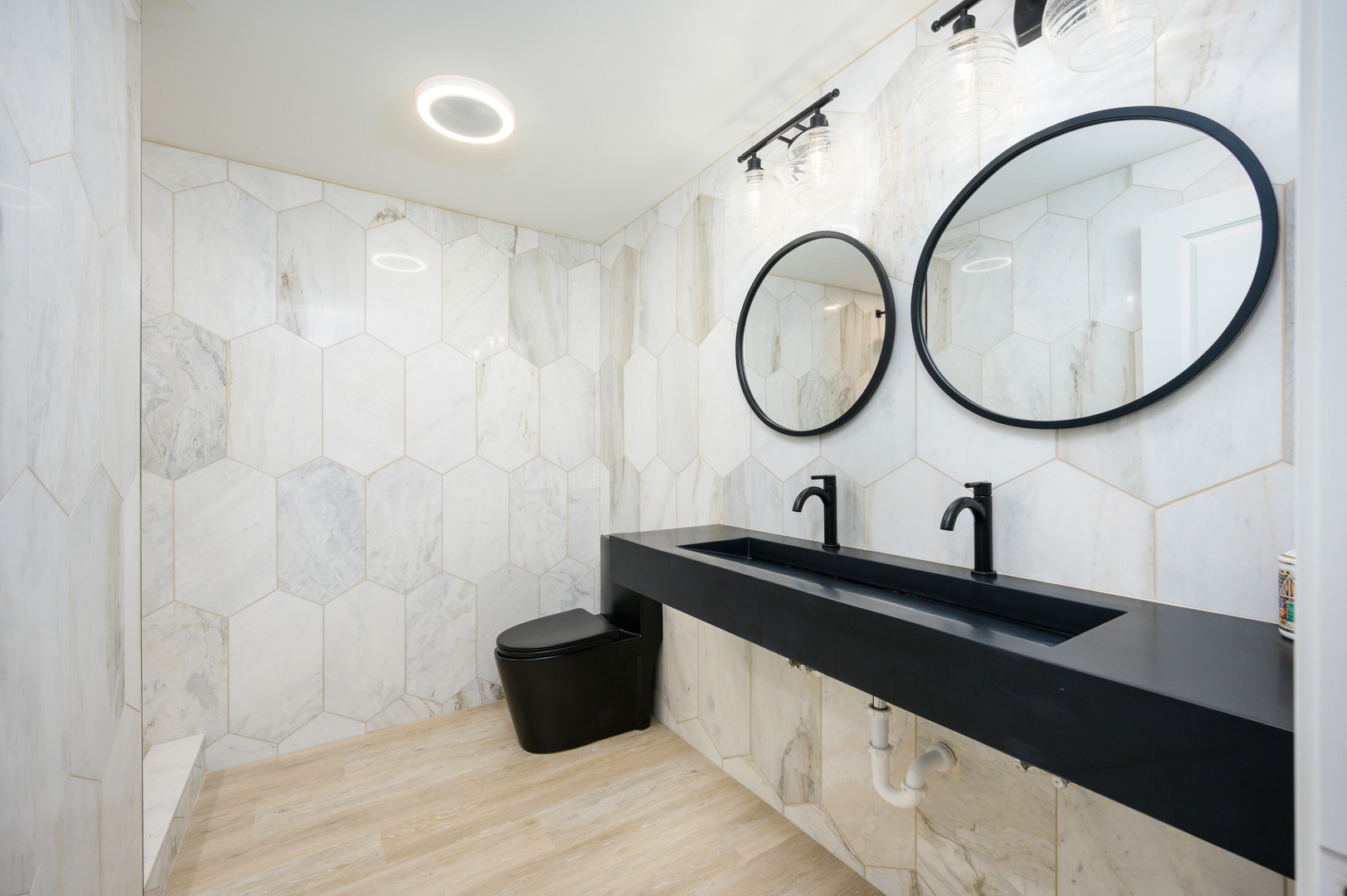 232 North Addison Avenue Elmhurst, IL 60126 - Photo 19 of 28 a bathroom with a sink a toilet and a mirror