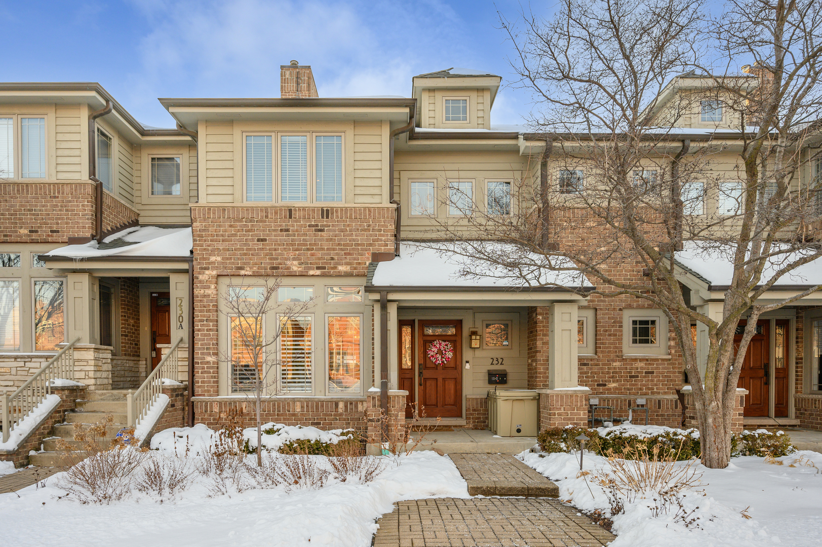 232 North Addison Avenue Elmhurst, IL 60126 - Photo 28 of 28 a view of a brick house with large windows and couches chairs