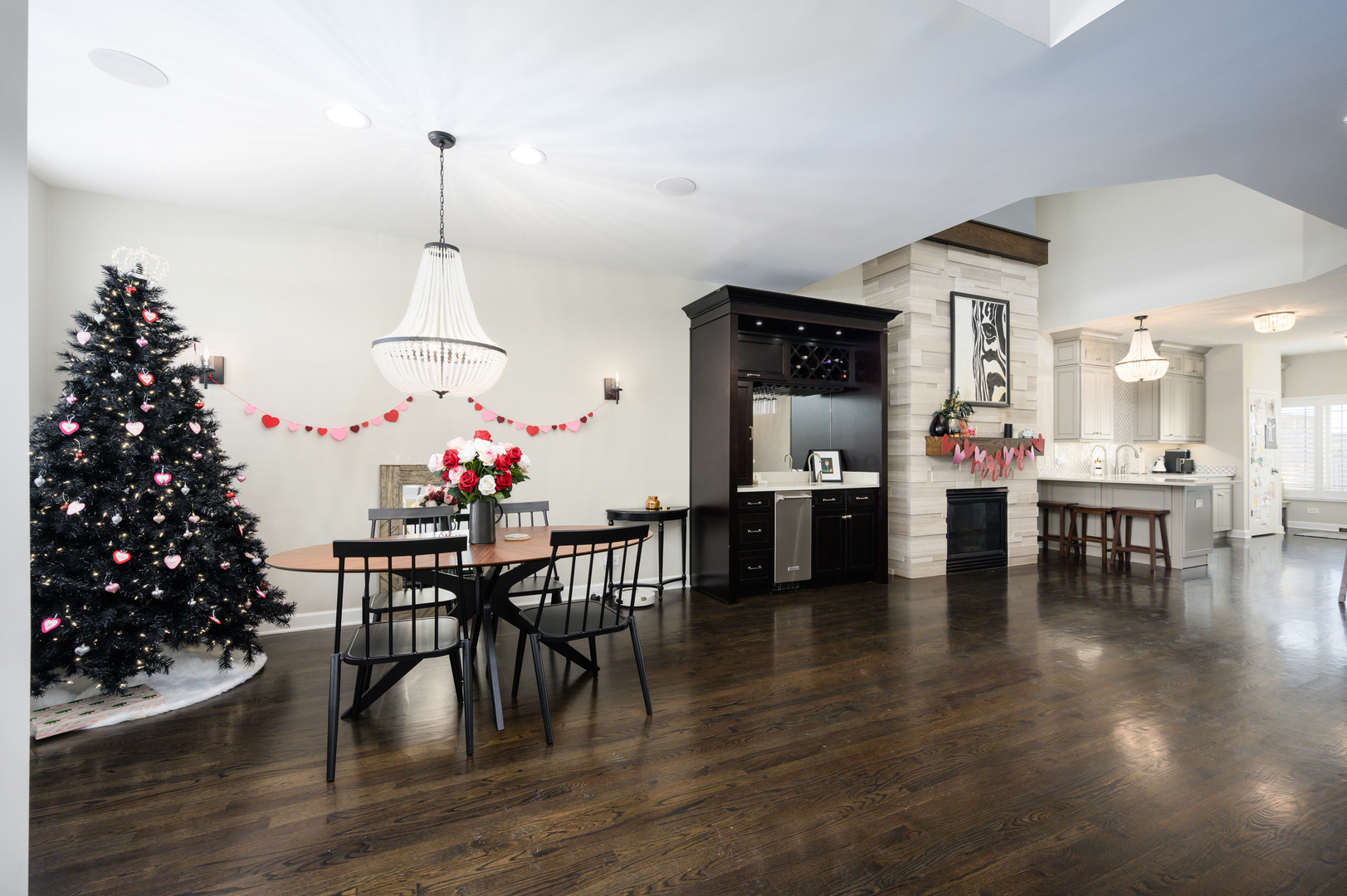 232 North Addison Avenue Elmhurst, IL 60126 - Photo 3 of 28 a view of a dining room and livingroom with furniture wooden floor a chandelier