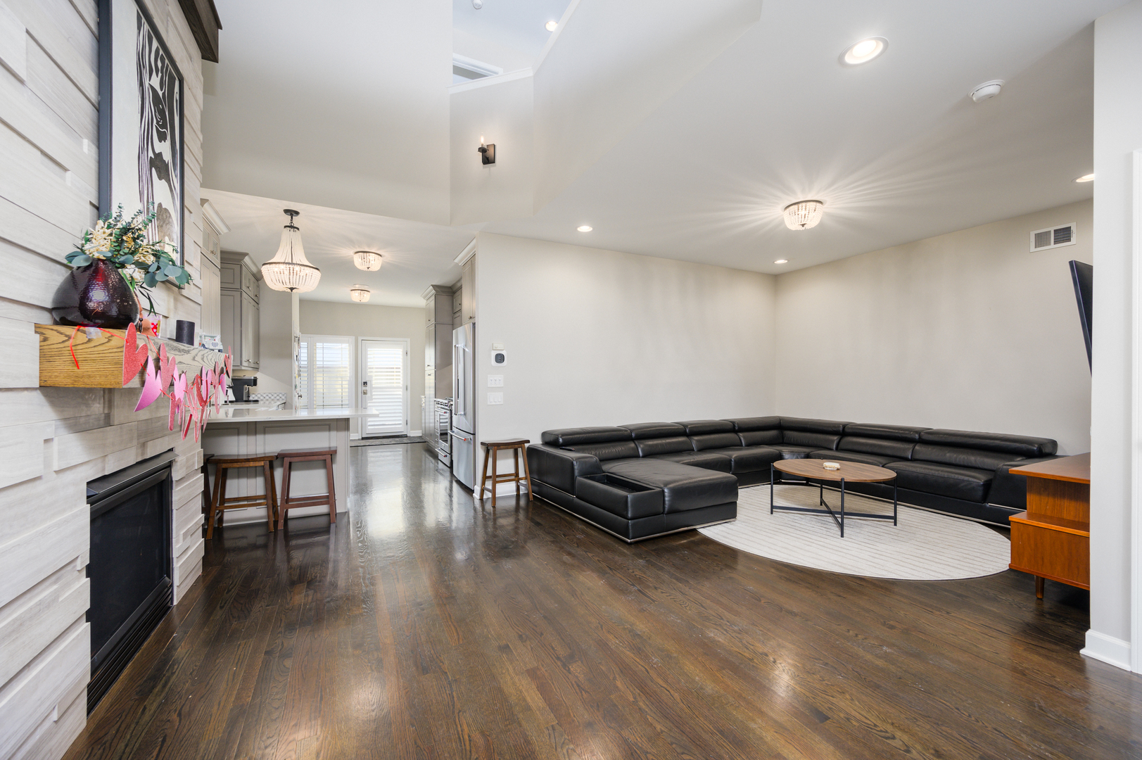 232 North Addison Avenue Elmhurst, IL 60126 - Photo 4 of 28 a living room with furniture pool table wooden floor and a fireplace